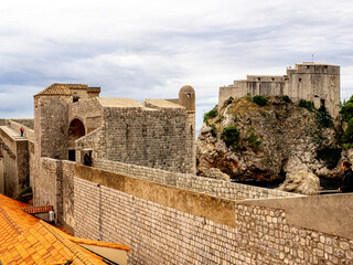 Looking out over ancient fortress wall and cliff fortress in Dubrovnik, Croatia.