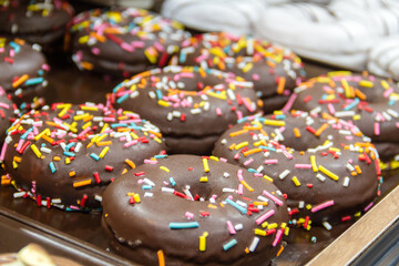 Chocolate donuts with colored sparks