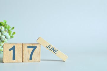 June 17, Calendar cover design with number cube with green fruit on blue background.