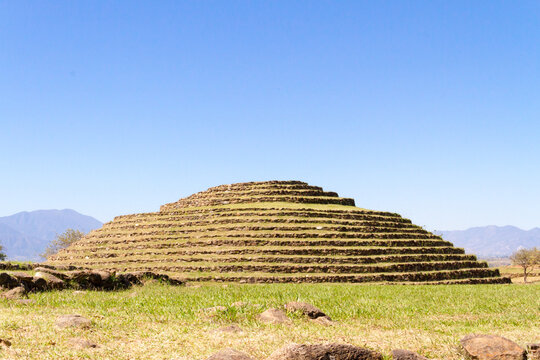 Ancient Circular Step Pyramid Monument at Guachimontones Archaeological Site under Clear Blue Sky, Teuchitlan Tradition Pre-Columbian Ruins in Teuchitlan, Jalisco, Mexico Travel Destination Background