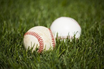 Baseballs in the grass