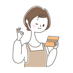 通帳を持ちOKサインを出す女性