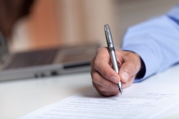 Naklejka premium Male Hand Signing a Document