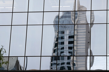 Reflection of skyscrapers in mirror windows. Chicago, Illinois