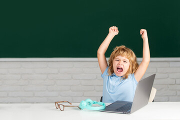 Elementary school kid angry and sad. Pupil screaming shouting in classroom. Bad school boy.