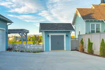 Light blue storage shed outside a house at Daybreak, Utah