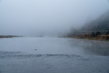 The view of the early autumn morning when the water fog rises