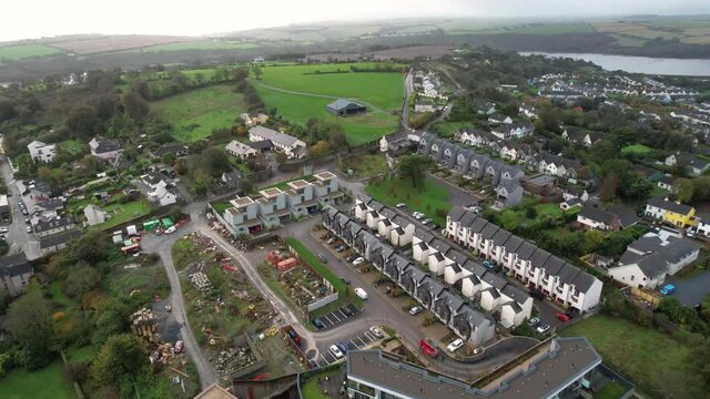 Aerial View of Kinsale, Cork County, Ireland, Row Houses in Residential Area Above Brandon River Bay, Drone Shot