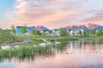 Oquirrh Lake with a reflection of the pink and orange hue colors of the sky