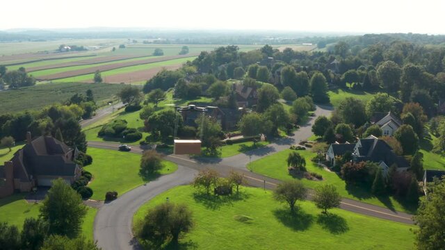 Drone delivers package box. Aerial follow tracking shot of futuristic logistics delivery theme.