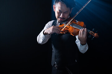 Image of a cool, handsome, bearded male violinist.