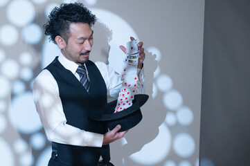 A magician performing on stage.
