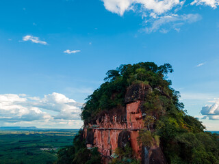 Aerial view of Beautiful mountain landscape with adventure wooden bridge on red stone cliff in blue sky of Wat Phu Thok temple, at Bueng Kan province amazing Thailand.