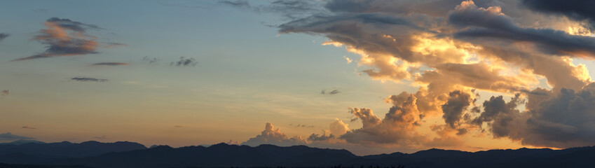 Panorama evening sunset sky orange clouds