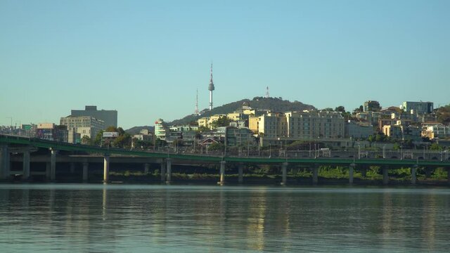 Zoom in to N Seoul Tower or Namsan Tower from Han river riverbank on cloudless autumn day, Yongsan -ru, Seoul South Korea  realtime 4k