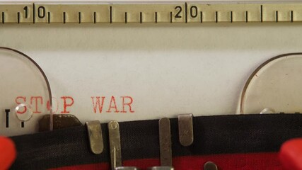 Type text Stop war on stationary mechanical typewriter. English language report concept. Paperwork and typescript. Sign or symbol of antiwar and stop aggression