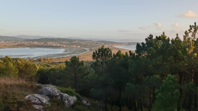 General static shot of the cove of La Lanzada with marsh on the left and sea beach on the right, Galicia Spain