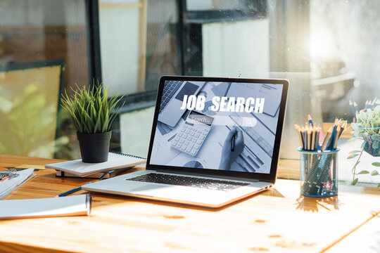 laptop with job search engine on screen in modern office.
