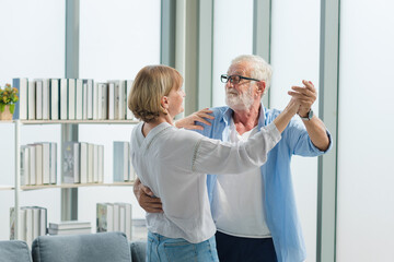 Elderly couple dancing together with happy and romantic emotion.