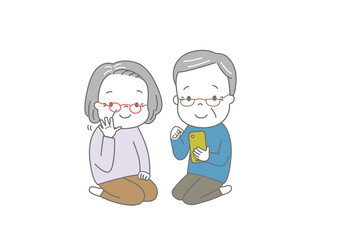 スマートフォンでビデオ通話を楽しむおじいさんとおばあさん