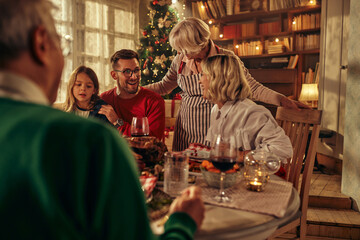 Adorable multi-generations family celebrating Christmas together