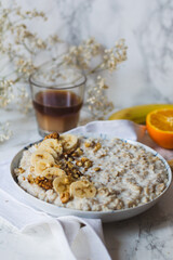 Banana porridge with rolled oats and milk