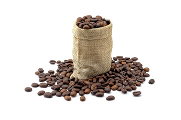 Heap of roasted coffee beans and hemp bag. isolated on a white background.