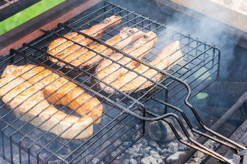 fresh salmon fish steaks on the grill. the concept of cooking on the street, backyard.