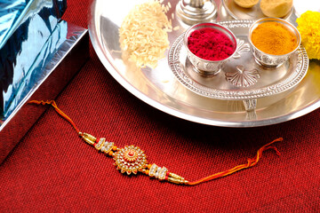 Indian festival: Raksha bandhan Raakhi with sweets gifts flowers and diya, Raksha Bandhan (Bond of protection and care), Indian festival of sisters and brothers.