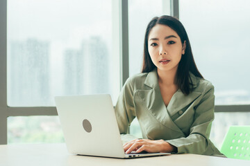 Businesswoman using laptop computer on work spec , Women trader online trading