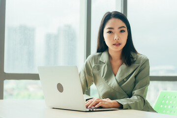 Businesswoman using laptop computer on work spec , Women trader online trading