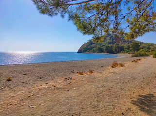 View of the stone beach at the site of the ancient Lycian city of Phaselis. Historic site