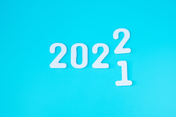 2022 white text number on blue background. Resolution, plan, review, goal, start and New Year holiday concepts