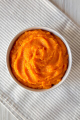 Raw Pumpkin Puree in a Bowl, top view. Flat lay, overhead, from above.
