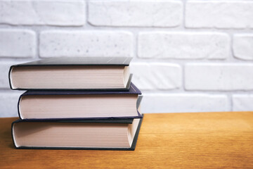 Stack of books close-up on wooden table