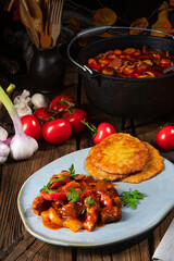 Original Hungarian goulash with potato pancakes