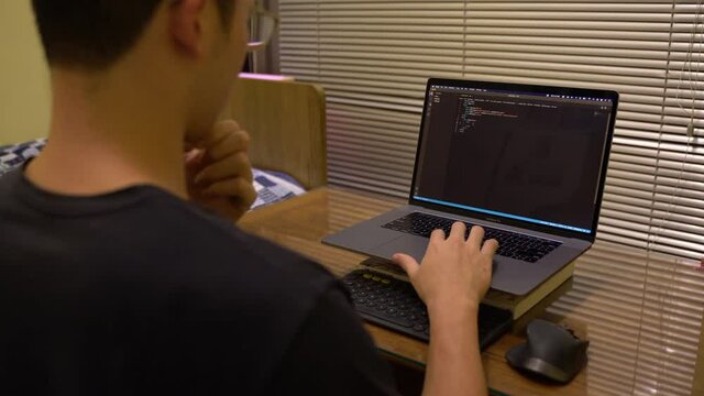 Programmer Creating Website Landing Page Using Visual Studio Code. time lapse