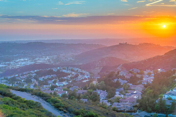 Aerial view of San Diego community against the sunset sky horizon