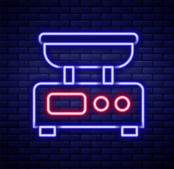 Glowing neon line Electronic scales icon isolated on brick wall background. Weight measure equipment. Colorful outline concept. Vector