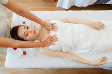 Young woman relaxing in spa massage