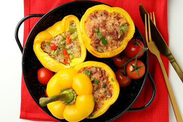 Concept of tasty food with stuffed pepper on white background