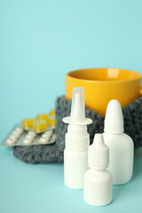 Flu treatment accessories on blue background, close up