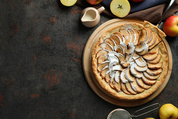 Concept of tasty food with apple pie on textured background