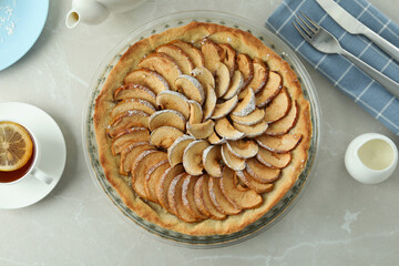 Concept of tasty food with apple pie on textured background