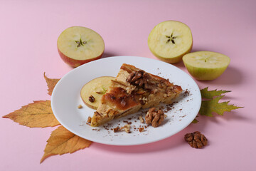 Concept of tasty food with apple pie on pink background