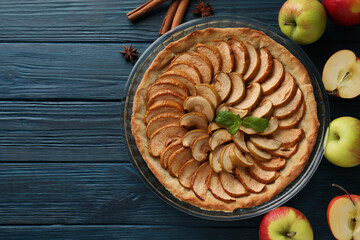 Concept of tasty food with apple pie on wooden background