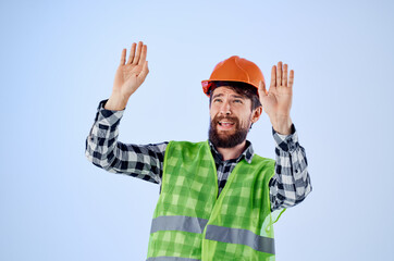 working man green vest orange helmet workflow hand gestures Studio