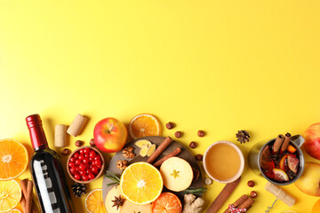 Ingredients for cooking mulled wine on yellow background