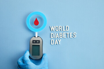 World diabetes day concept. Red blood drop in circle with Blood glucose test strip and Glucose...