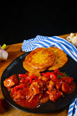Original Hungarian goulash with potato pancakes
